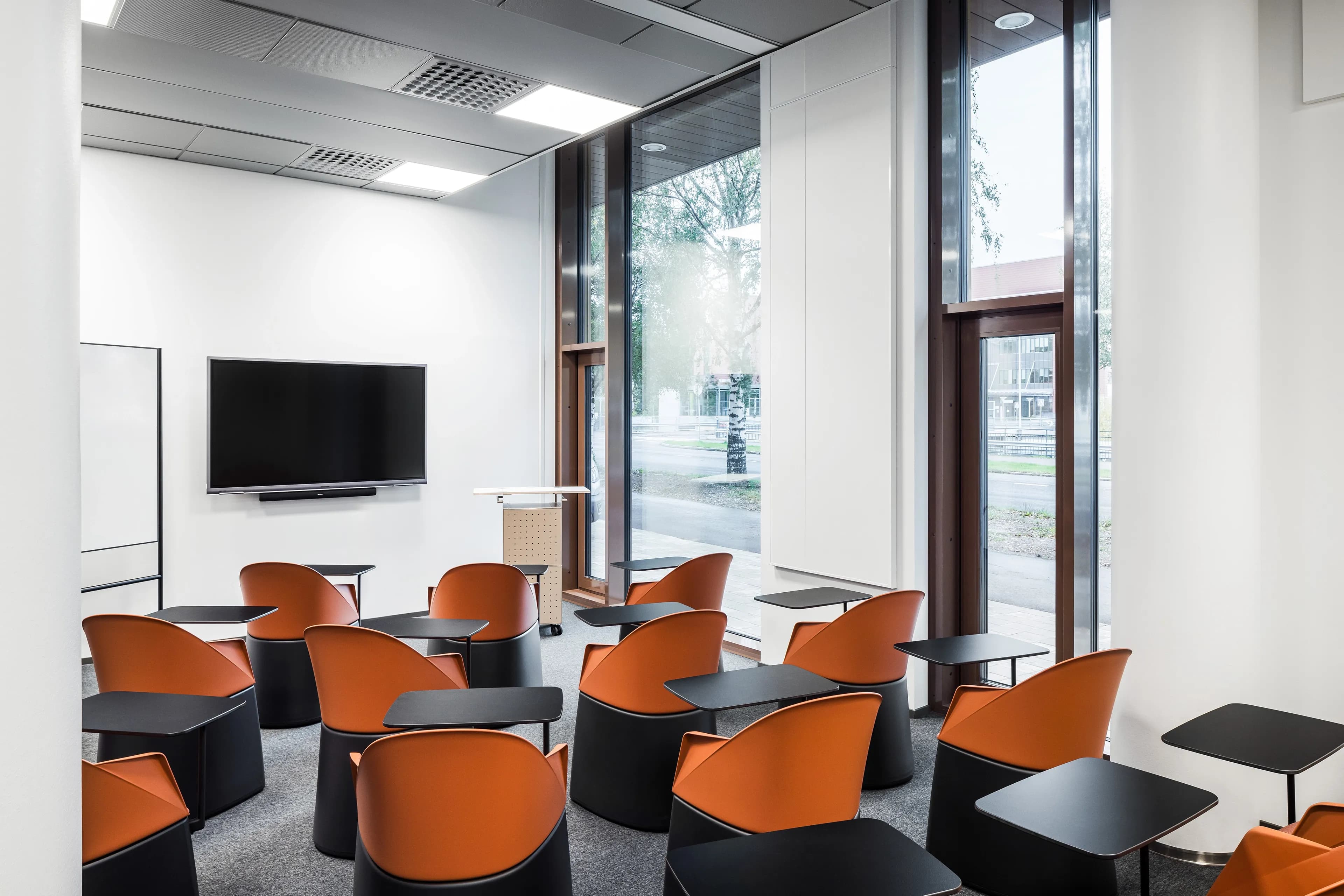 Classroom with red chairs at Helsinki Upper-Secondary School of Languages.